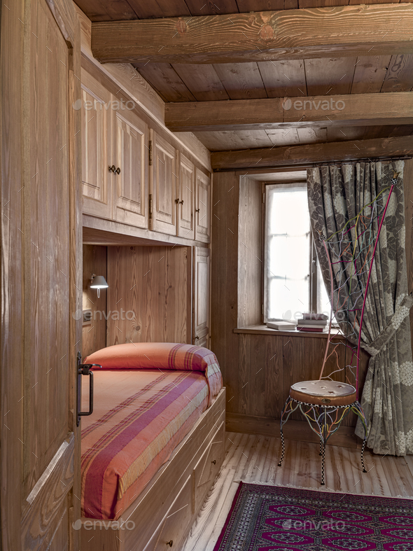 Interior of a Rustic Bedroom with Beamed Ceiling - Stock Photo - Images