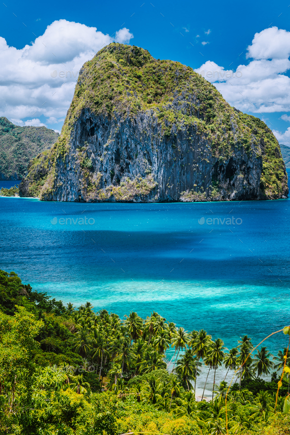 Breathtaking view of tropical coast with jungle and Pinagbuyutan Island in the blue ocean El Nido - Stock Photo - Images
