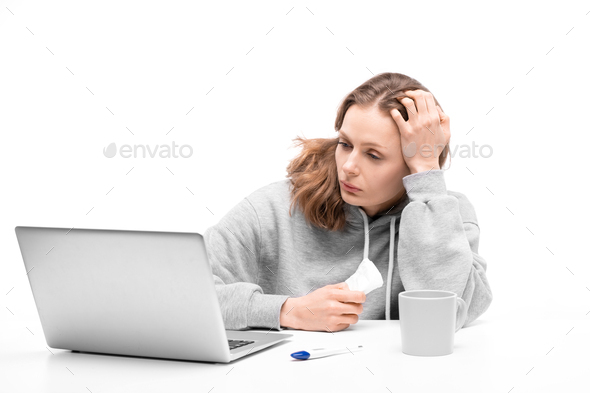Reading about symptoms on internet - Stock Photo - Images