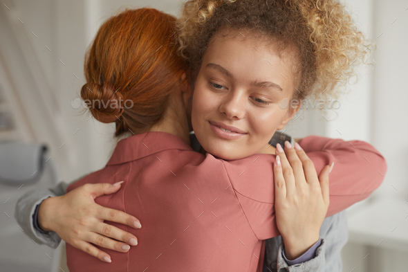 Woman embracing her friend