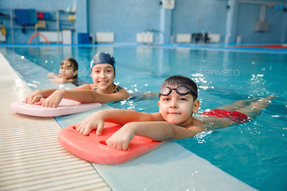 Kid girl in swimming pool at summer vacation Stock Photo by ©lunamarina  63226465