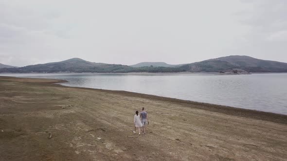 Young couple in cloudy weather alt