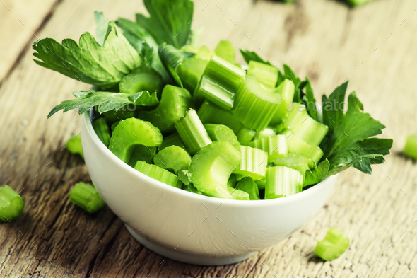 Fresh sliced celery in a white bowl Stock Photo by Olga_Kochina