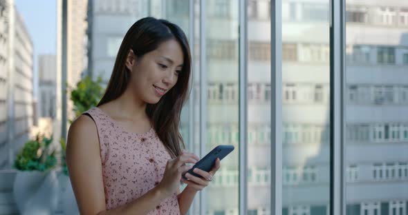 Woman use mobile phone alt