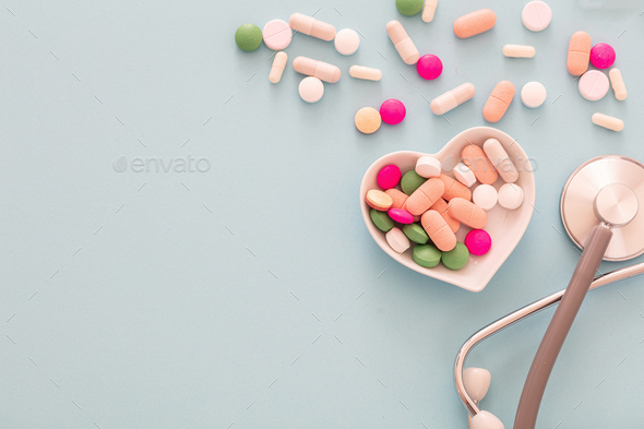 Medicine pills and capsules on pastel blue background. Health pharmacy  concept Stock Photo by rawf8
