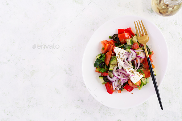 Greek salad with fresh vegetables, feta cheese and black olives. - Stock Photo - Images