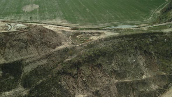 Conserved landfill for household waste. A mound of rubbish. Aerial photography. alt