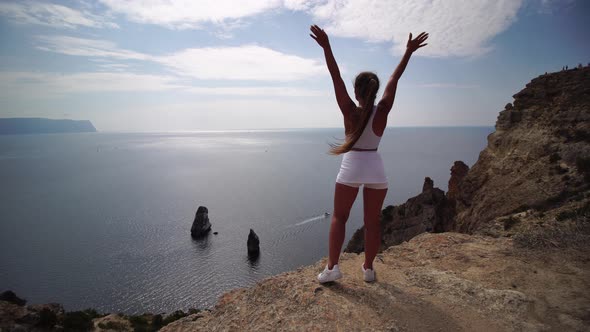 Well Looking Middle Aged Sporty Woman with Long Hair Fitness Instructor in White Sportswear Enjoys alt