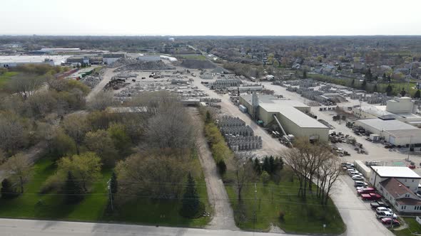 Industrial business park on edge of city. Residential neighborhood on one side.