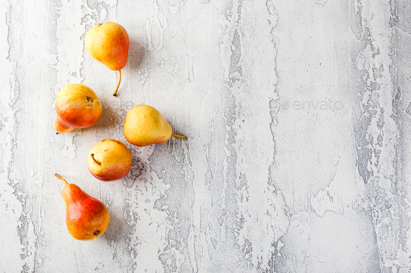 Fresh bio pears on the grey background