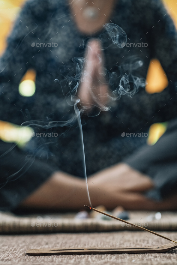 Mindful Woman in Self-Healing Meditation with Burning Incense Sticks
