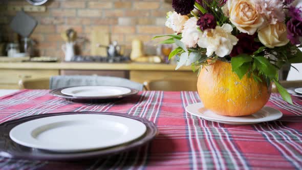 Aged Person Hands Put Red Decorative Napkins on White Plates