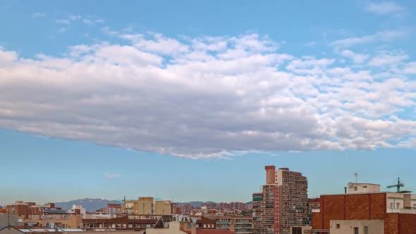 Timelapse of Panoramic View From Badalona to Barcelona Rooftops and Clouds Passing By on Summer Day