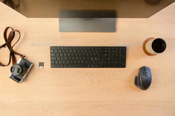 Top View of Creative Office Desk with Monitor and Camera with Hot Cup of  Coffee Stock Photo by kjekol