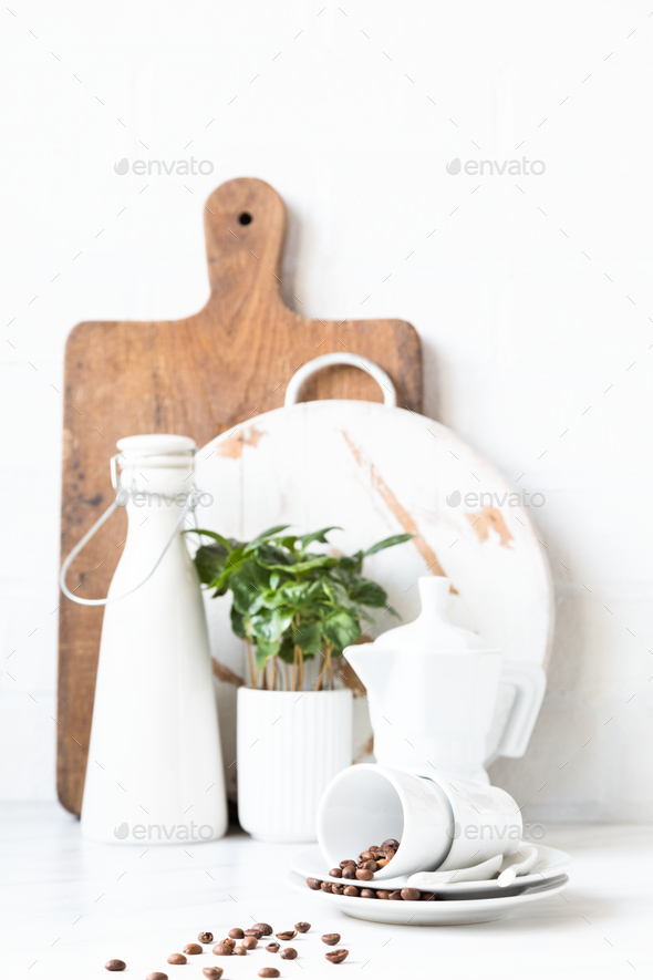 Kitchen utensils on a background of a white brick wall. Concept of the decor of the kitchen.