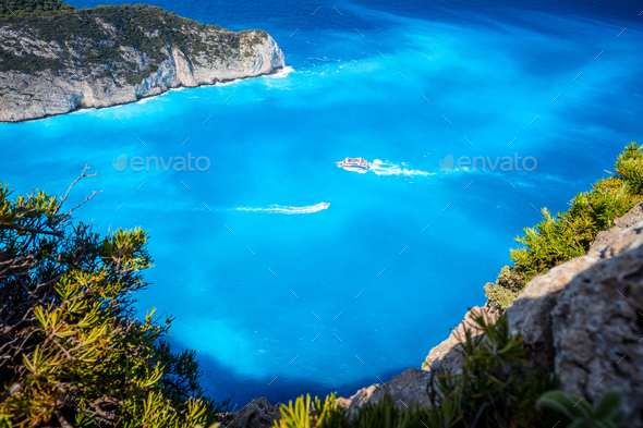 Navagio beach, Zakynthos, Greece. Tourist trip boats visiting and leaving Shipwreck bay with - Stock Photo - Images