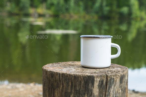 Placeit – White enamel mug mockup with tree stump - Stock Photo - Images
