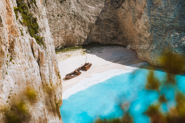 Close up of Navagio beach called Shipwreck bay. Turquoise water and pebble white beach and limestone - Stock Photo - Images