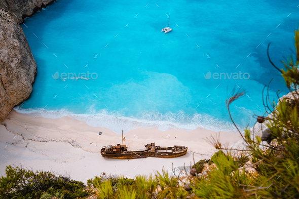 Close up of Shipwreck in Navagio beach. Azure turquoise sea water and paradise sandy beach. Famous - Stock Photo - Images