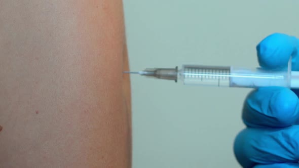 The Person Receives The Vaccine. The Syringe Vaccine