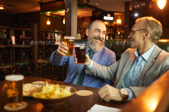 Men celebrating in the bar
