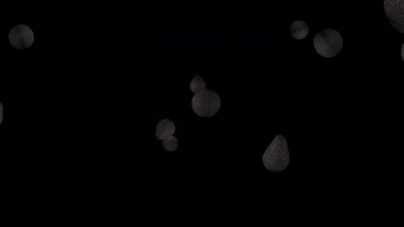 Falling avocados on a black background