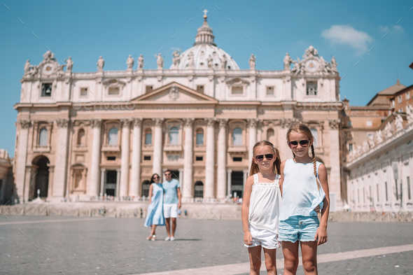 Happy family at St. Peter\'s Basilica church in Vatican city