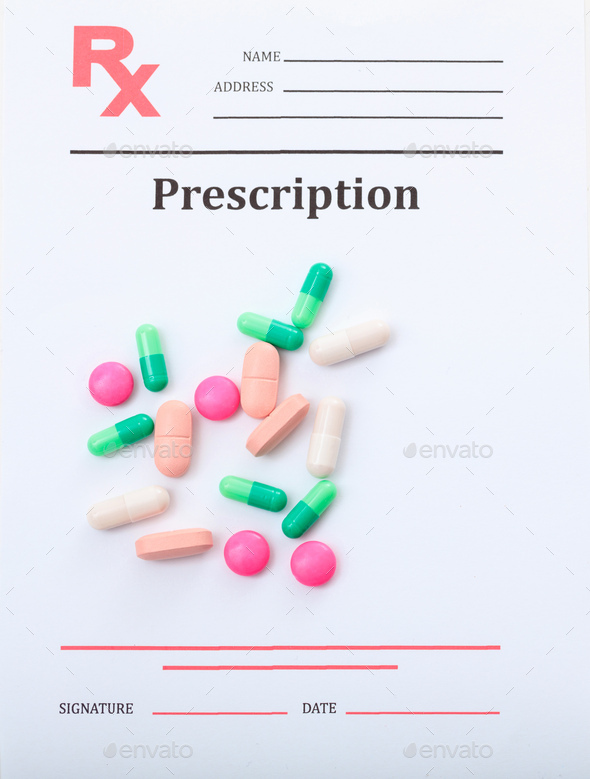Medicine pills on medical prescription rx document