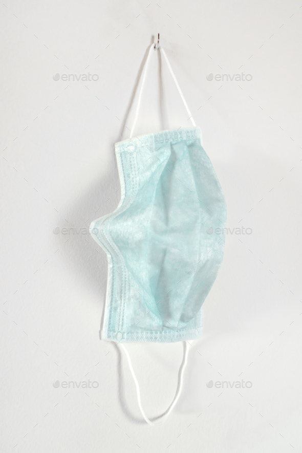 Medical mask hanging on the wall - Stock Photo - Images