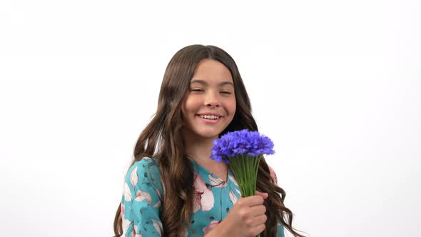 Happy Teen Girl Floral Dress Turning Smell Centaurea Wildflower Flower Bloom Summer Joy alt