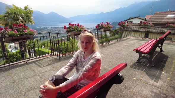 Woman on Top of Cardada Mount in Switzerland alt