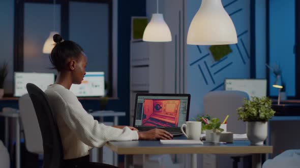 Dark Skin Gamer Developer Working at Video Game in Midnight alt