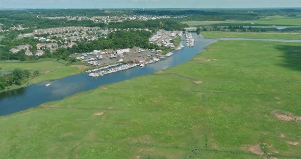 Amazing Panoramic View Little Harbour for Many Boat Floating Near the Ocean in USA alt