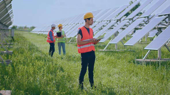 Young Ecological Engineer Man at Photovoltaic