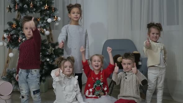 A group of children with New Year's gifts, happy friends for Christmas alt
