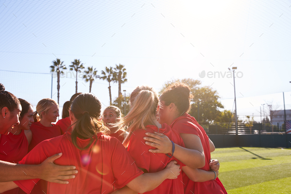 Womens Football Team In Huddle Having Motivational Pep Talk Before Soccer Match