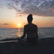 Young Woman Meditating Near The Sea - VideoHive Item for Sale
