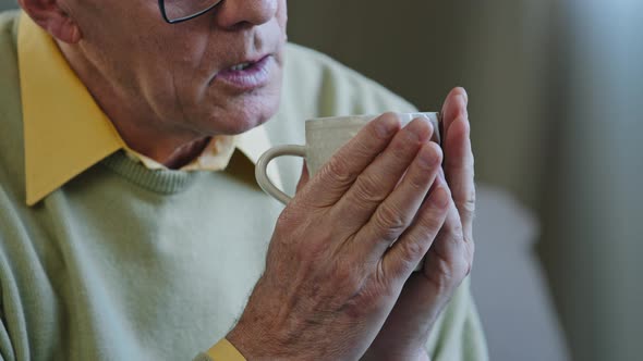 Cropped View Caucasian Sad Pensive Elderly Retired Grandpa in Glasses Thinking Drinking Hot Tea alt