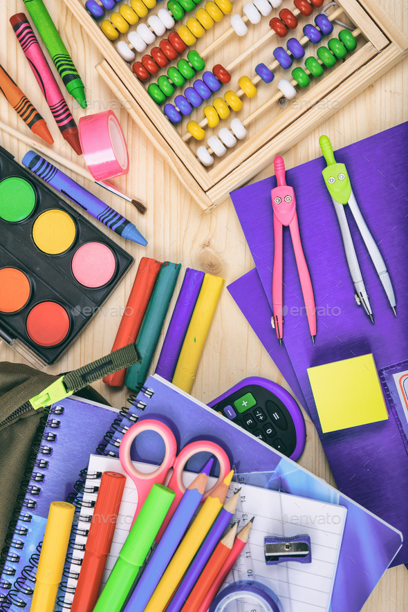 School supplies on wooden desk. Kid creativity flat lay Stock