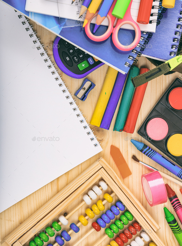 School supplies on wooden desk. Kid creativity flat lay Stock Photo by rawf8