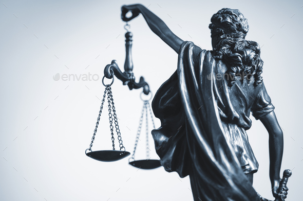 Cropped view of statue of Justice with the scales - Stock Photo - Images