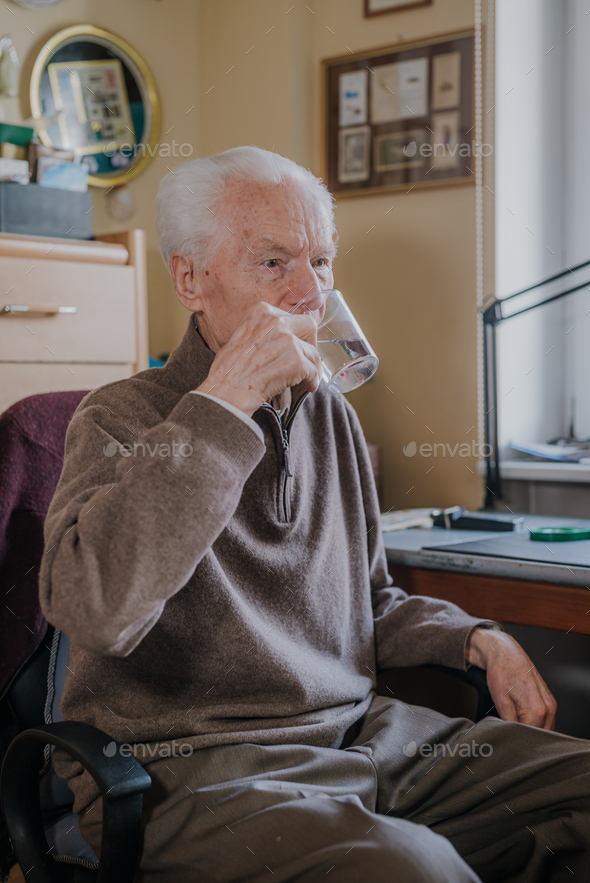 Old man drinking water closeup - Stock Photo - Images