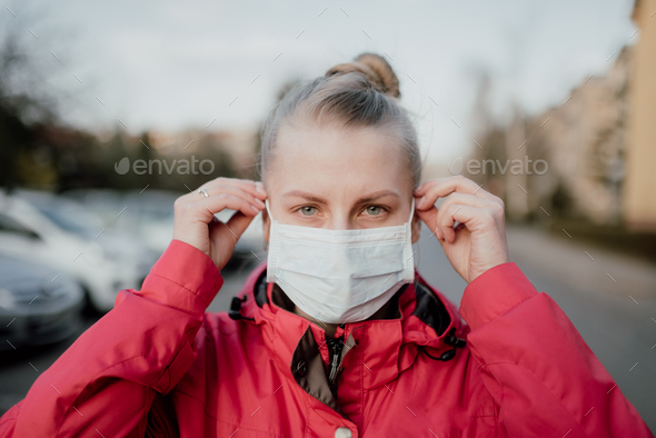 Portrait of Woman Wearing Protective Mask Against Covid-19 Outdoors - Stock Photo - Images