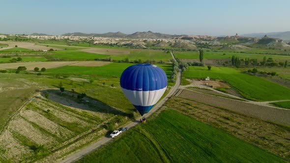 4K Aerial view of Goreme. Colorful hot air balloons fly over the valleys. alt