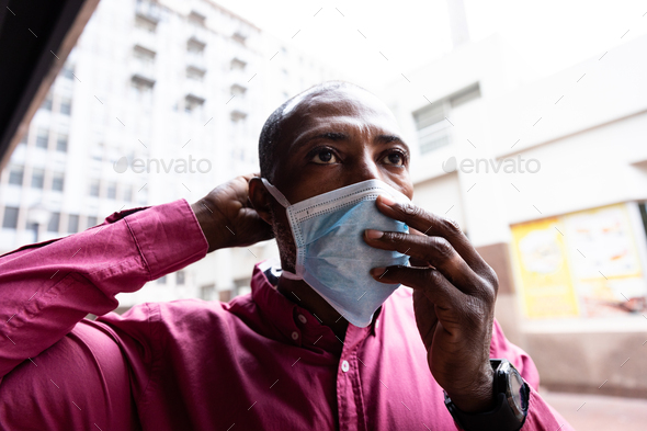 African American wearing covid19 coronavirus mask in the street