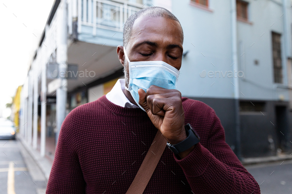 African American wearing covid19 coronavirus mask in the street