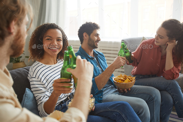 Group of Friends Drinking Beer at Home