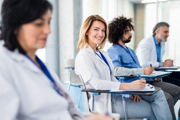 Group of doctors listening to presentation on medical conference