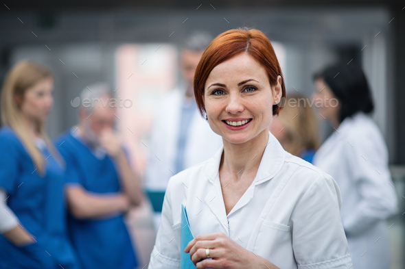 Portrait of doctor standing in hospital on medical conference