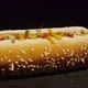 Camera Revolves Around a Hot Dog in a Bun of Sesame and Sausage - VideoHive Item for Sale